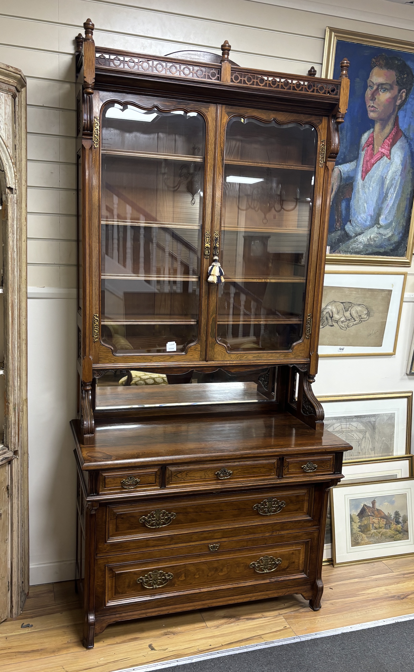 A Victorian rosewood bookcase, width 108cm, depth 52cm, height 232cm